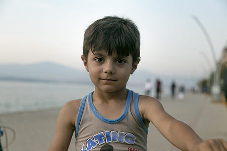 child wearing brown tank top thumbnail