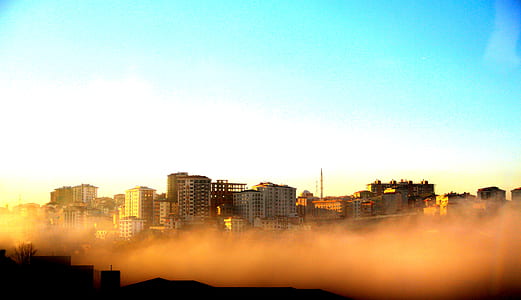 Photography of Buildings on a Foggy Morning thumbnail