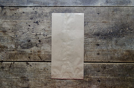 brown paper bag on brown wooden surface thumbnail