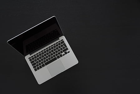 turned-off MacBook Pro on gray surface thumbnail