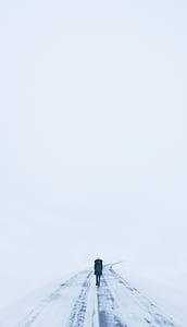 person walking on snowfield thumbnail