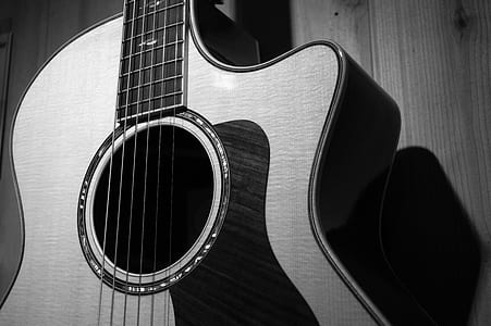 cut-away acoustic guitar grayscale photo thumbnail