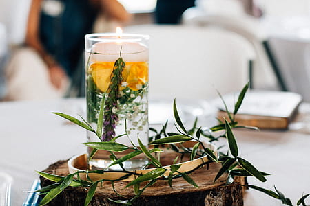 white oil candle in clear glass cup thumbnail