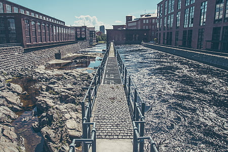black metal bridge in the middle of water thumbnail