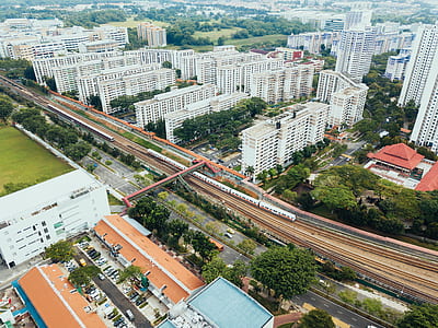 aerial photography of train and high-rise buildings thumbnail