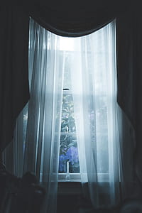 white window covered with white mesh curtain thumbnail