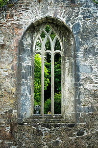 close up photography of gray brick wall with window thumbnail