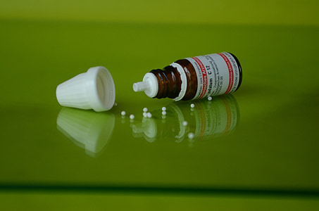 brown bottle on green surface thumbnail