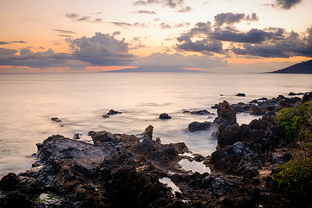 landscape photography of body of water under nimbus clouds thumbnail