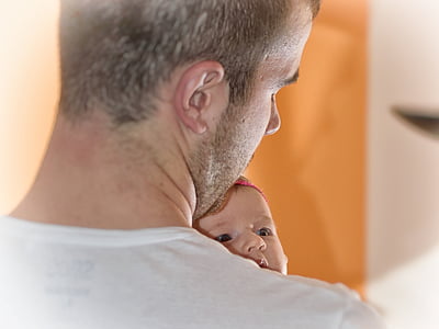 man carrying baby thumbnail