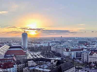 cityscape of concrete buildings during golden hour thumbnail