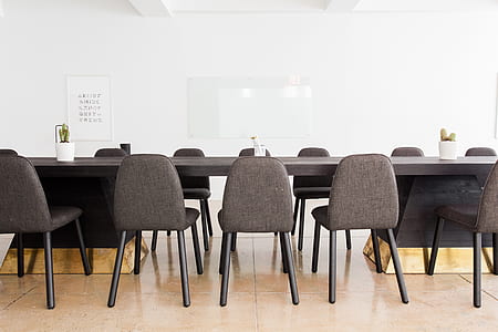 empty brown wooden table and chairs set thumbnail