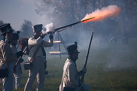 man firing rifle thumbnail