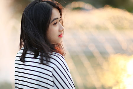 woman wearing white and black striped top thumbnail
