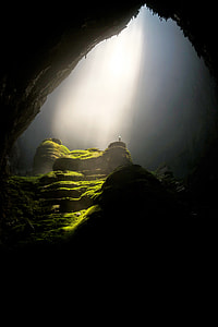 Light shining through on a cave in Vietnam thumbnail