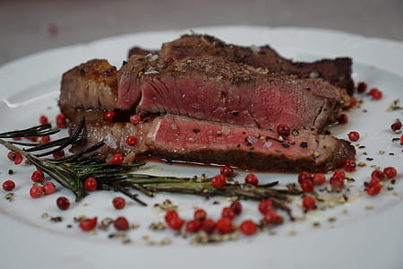 cooked steak on white plate thumbnail