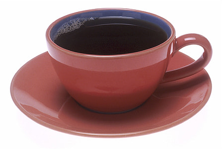 brown ceramic cup on brown ceramic saucer thumbnail