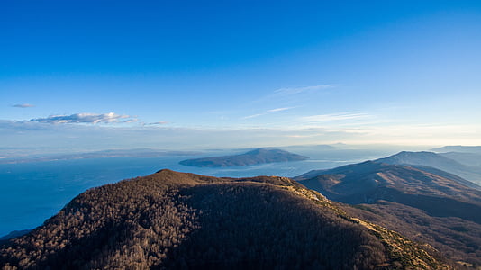 aerial view of mountains near ocean thumbnail