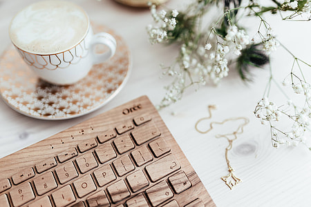 Wooden keyboard and cup of coffee thumbnail