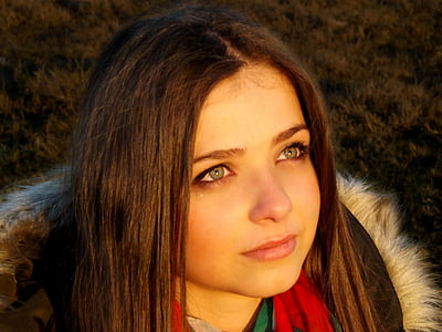 close up photo of woman wearing parka coat thumbnail