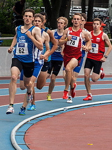 group of male runners on track field thumbnail
