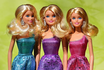 close-up photo of three dolls thumbnail