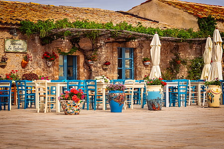 table arrangements outside brown brick building thumbnail