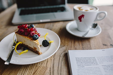Working in a restaurant: Macbook, Cheese Cake and Cup of Coffee thumbnail