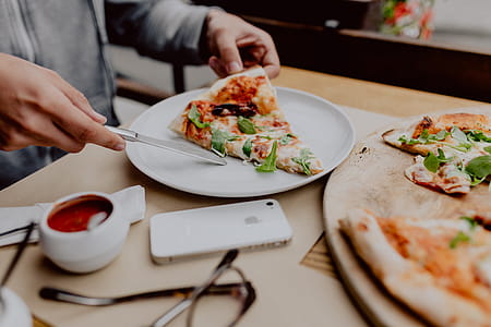 Eating delicious pizza in a cozy restaurant thumbnail