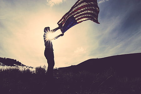 person raising U.S. flag thumbnail