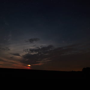 moon coated with clouds at daytime thumbnail