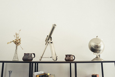 gray metal telescope decor in a well lit room thumbnail