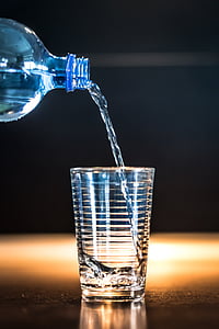 water coming from bottle to drinking glass thumbnail