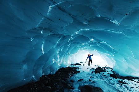 person walking inside ice cove thumbnail