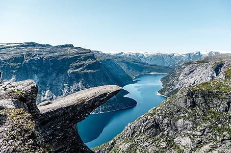 aerial photography of mountains near body of water thumbnail