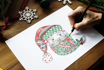 Person Drawing Gnome on White Printer Paper thumbnail
