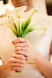 woman holding white flower bouquet thumbnail