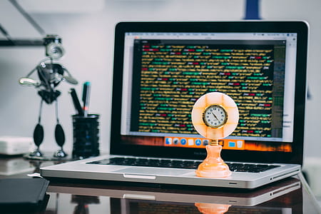 beige clock on silver MacBook thumbnail