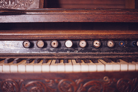 brown wooden upright piano thumbnail