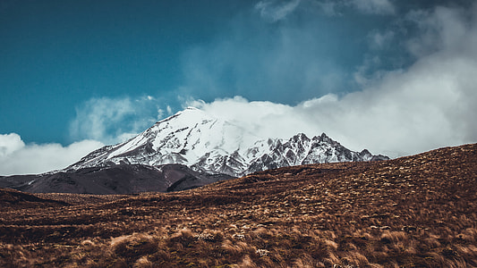 landscape photo of gray mountain covered with snow at daytime thumbnail