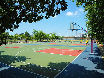 empty green and red basketball court at daytime thumbnail