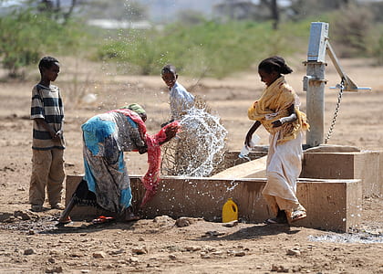 four person playing on water well thumbnail
