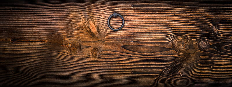 Gray Metal Door Knocker on Wooden Panel thumbnail