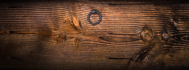 brown wooden board with door knocker thumbnail