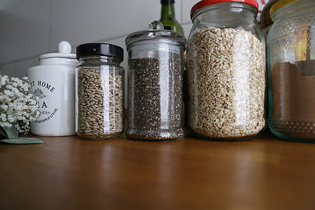 assorted-size glass jars on brown wooden table thumbnail