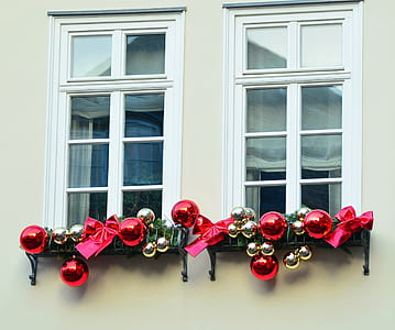 gold and red baubles on white wooden framed glass window thumbnail