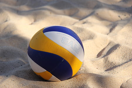 close-up photo of yellow, white, and blue volleyball ball thumbnail