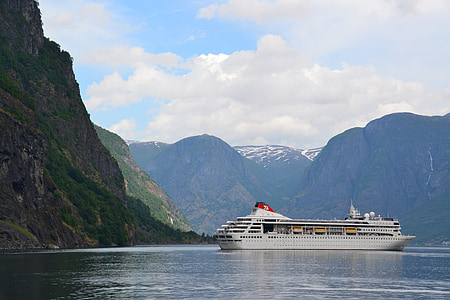 cruise ship near mountains thumbnail