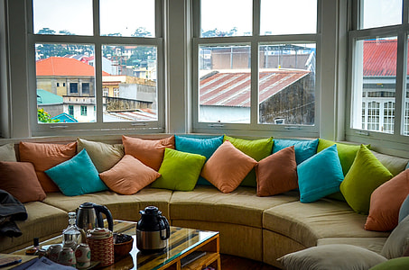 brown fabric corner sofa with throw pillows thumbnail