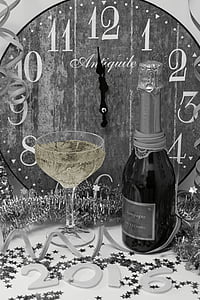grayscale photography of wine bottle beside wine glass thumbnail